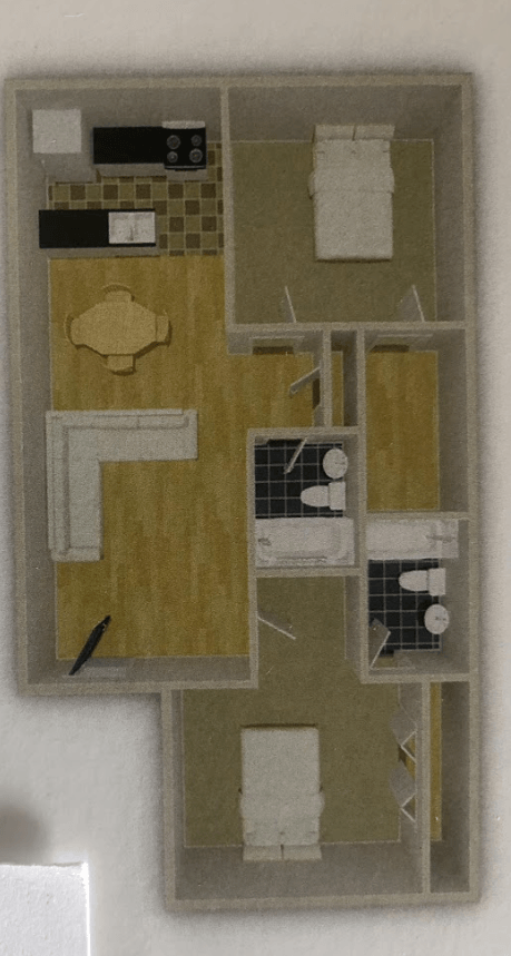 a floor plan of a house with a pencil in the middle of it